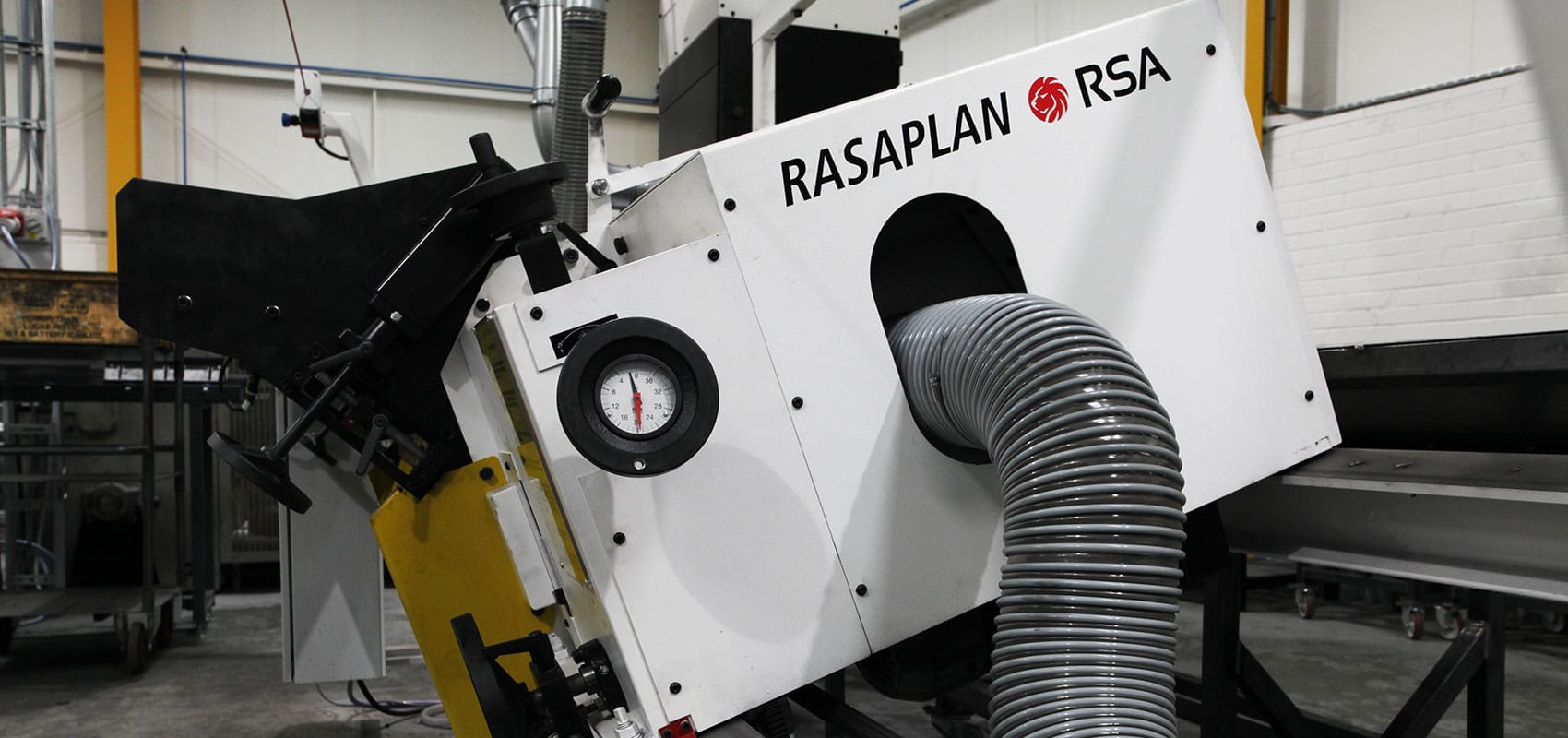 A vibratory trough deburring machine