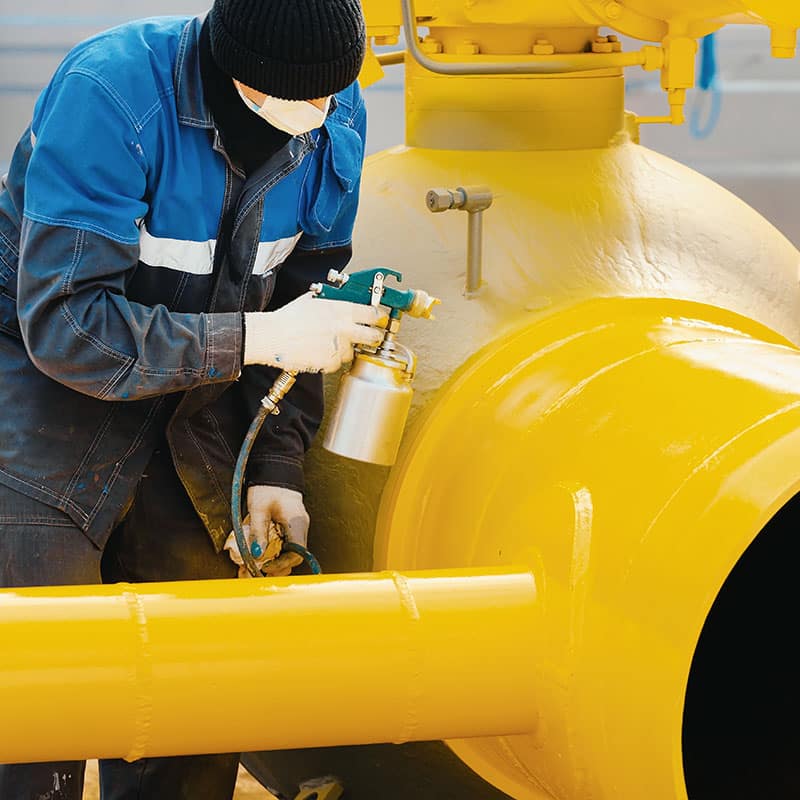 Manufacturer painting metal parts yellow