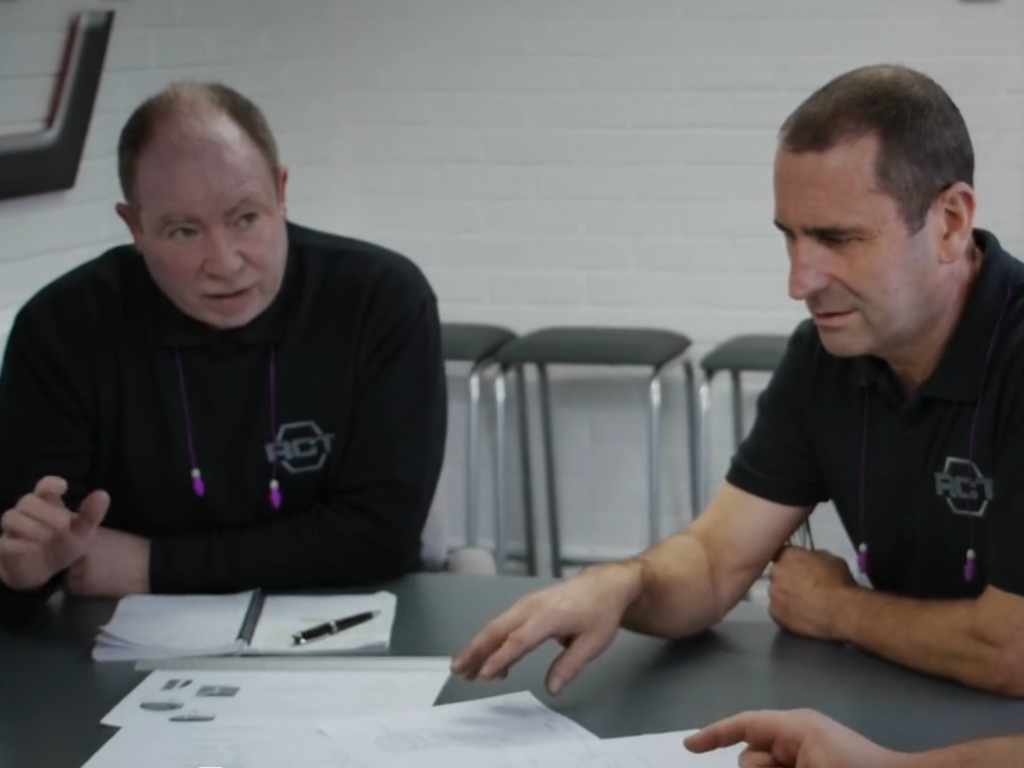 Engineers in a design for manufacturing meeting.