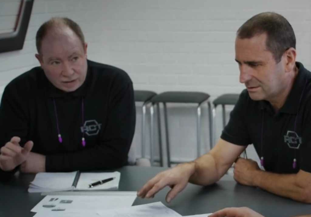 Engineers in a design for manufacturing meeting.